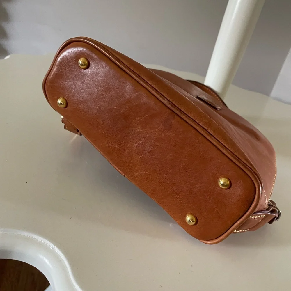 Dooney and Bourke Florentine leather small backpack.